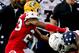 Jan 26, 2013; Mobile, AL, USA; Senior Bowl south squad defensive back Robert Alford of Southeastern Louisiana (23) tackles Senior Bowl north squad wide receiver Marquise Goodwin of Texas (1) during the first half of the Senior Bowl at Ladd-Peebles Stadium. Mandatory Credit: Derick E. Hingle-USA TODAY Sports