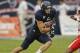 HOUSTON, TX - SEPTEMBER 29: Vance McDonald #88 of the Rice Owls looks for room to run as Colton Valencia #20 of the Houston Cougars defends at Reliant Stadium on September 29, 2012 in Houston, Texas. (Photo by Bob Levey/Getty Images)