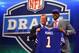 NEW YORK, NY - APRIL 25: E.J. Manuel of the Florida State Seminoles stands with NFL Commissioner Roger Goodell (L) as they hold up a jersey on stage after Manuel was picked #16 overall by the Buffalo Bills in the first round of the 2013 NFL Draft at Radio City Music Hall on April 25, 2013 in New York City. (Photo by Al Bello/Getty Images)