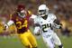 LOS ANGELES, CA - NOVEMBER 03: Running back Kenjon Barner #24 of the Oregon Ducks carries the ball against linebacker Tony Burnett #34 of the USC Trojans in the third quarter at the Los Angeles Memorial Coliseum on November 3, 2012 in Los Angeles, California. Oregon won 62-51. (Photo by Stephen Dunn/Getty Images)