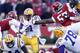 FAYETTEVILLE, AR - NOVEMBER 23: Spencer Ware #11 of the LSU Tigers is tackled by Jared Green #57 of the Arkansas Razorbacks at Razorback Stadium on November 23, 2012 in Fayetteville, Arkansas. The Tigers defeated the Razorbacks 20-13. (Photo by Wesley Hitt/Getty Images)