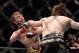 Apr 27, 2013; Newark, NJ, USA; Bryan Caraway (blue shorts) competes against Johnny Bedford (black shorts) during UFC 159 at the Prudential Center. Mandatory Credit: Brad Penner-USA TODAY Sports