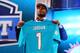 NEW YORK, NY - APRIL 25: Dion Jordan of the Oregon Ducks holds up a jersey on stage after he was picked #3 overall by the Miami Dolphins in the first round of the 2013 NFL Draft at Radio City Music Hall on April 25, 2013 in New York City. (Photo by Al Bello/Getty Images)