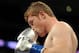 LOS ANGELES, CA - SEPTEMBER 18: Saul Alvarez of Mexico Carlos kisses his gloves before his match against Baldomir of Argentina in the WBC Super Welterweight Silver Title fight at Staples Center on September 18, 2010 in Los Angeles, California. (Photo by Harry How/Getty Images)