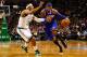 BOSTON, MA - JANUARY 24: Carmelo Anthony #7 of the New York Knicks drives to the basket in front of Paul Pierce #34 of the Boston Celtics during the game on January 24, 2013 at TD Garden in Boston, Massachusetts. NOTE TO USER: User expressly acknowledges and agrees that, by downloading and or using this photograph, User is consenting to the terms and conditions of the Getty Images License Agreement. (Photo by Jared Wickerham/Getty Images)
