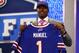 NEW YORK, NY - APRIL 25: E.J. Manuel of the Florida State Seminoles holds up a jersey on stage after he was picked #16 overall by the Buffalo Bills in the first round of the 2013 NFL Draft at Radio City Music Hall on April 25, 2013 in New York City. (Photo by Al Bello/Getty Images)