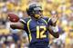 PITTSBURGH, PA - SEPTEMBER 01: Geno Smith #12 of the West Virginia Mountaineers drops back to pass against the Marshall Thundering Herd during the game on September 1, 2012 at Mountaineer Field in Morgantown, West Virginia. (Photo by Justin K. Aller/Getty Images)