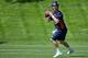 ENGLEWOOD, CO - MAY 21: Quarterback Peyton Manning #18 of the Denver Broncos drops back during organized team activities at Dove Valley on May 21, 2012 in Englewood, Colorado. (Photo by Justin Edmonds/Getty Images)