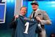 NEW YORK, NY - APRIL 25: Lane Johnson of the Oklahoma Sooners stands with NFL Commissioner Roger Goodell (L) as they hold up a jersey on stage after Johnson was picked #4 overall by the Philadelphia Eagles in the first round of the 2013 NFL Draft at Radio City Music Hall on April 25, 2013 in New York City. (Photo by Al Bello/Getty Images)