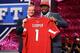 NEW YORK, NY - APRIL 25: Jonathan Cooper of North Carolina Tar Heels stands with NFL Commissioner Roger Goodell (L) as they hold up a jersey on stage after Cooper was picked #7 overall by the Arizona Cardinals in the first round of the 2013 NFL Draft at Radio City Music Hall on April 25, 2013 in New York City. (Photo by Al Bello/Getty Images)