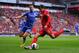 LIVERPOOL, ENGLAND - APRIL 21: Cesar Azpilicueta of Chelsea closes down Philippe Coutinho of Liverpool during the Barclays Premier League match between Liverpool and Chelsea at Anfield on April 21, 2013 in Liverpool, England. (Photo by Michael Regan/Getty Images)