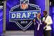 NEW YORK, NY - APRIL 25: Cordarelle Patterson (L) of the Tennessee Volunteers stands with NFL Commissioner Roger Goodell as they hold up a jersey after Patterson was selected #29 overall by the Minnesota Vikings in the first round of the 2013 NFL Draft at Radio City Music Hall on April 25, 2013 in New York City. (Photo by Al Bello/Getty Images)