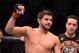 Mar 16, 2013; Montreal, Quebec, CAN; Patrick Cote celebrates after defeating Bobby Voelker (not pictured) in their preliminary round bout at UFC 158 at the Bell Centre. Mandatory Credit: Eric Bolte-USA TODAY Sports