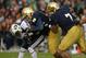 SOUTH BEND, IN - OCTOBER 20: Jamaal Williams #21 of the BYU Cougars is dropped by Stephon Tuitt #7 and Louis Nix III #9 of the Notre Dame Fighting Irish at Notre Dame Stadium on October 20, 2012 in South Bend, Indiana. Notre Dame defeated BYU 17-14. (Photo by Jonathan Daniel/Getty Images)