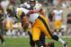 CHICAGO, IL - SEPTEMBER 01: C.J. Fiedorowicz #86 of the Iowa Hawkeyes runs after a catch as Victor Jacques #40 of the Northern Illinois Huskies moves in for the tackle at Soldier Field on September 1, 2012 in Chicago, Illinois. Iowa defeated Northern Illinois 18-17. (Photo by Jonathan Daniel/Getty Images)