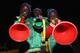 NELSPRUIT, SOUTH AFRICA - JUNE 23: Football fans blow vuvuzelas as they enjoy the atmosphere ahead of the 2010 FIFA World Cup South Africa Group C match between USA and Algeria at the Loftus Versfeld Stadium on June 23, 2010 in Tshwane/Pretoria, South Africa. (Photo by Christof Koepsel/Getty Images)