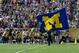 Jan 1, 2013; Tampa, FL, USA; Michigan Wolverines cheerleaders run onto the field before a game against the South Carolina Gamecocks in the Outback Bowl at Raymond James Stadium. Mandatory Credit: Jeff Griffith-USA TODAY Sports