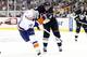 PITTSBURGH, PA - MAY 1: James Neal #18 of the Pittsburgh Penguins checks Kyle Okposo #21 of the New York Islanders in Game One of the Eastern Conference Quarterfinals during the 2013 NHL Stanley Cup Playoffs at Consol Energy Center on May 1, 2013 in Pittsburgh, Pennsylvania. (Photo by Justin K. Aller/Getty Images)