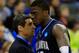 KANSAS CITY, MO - MARCH 22: Head coach Jay Wright of the Villanova Wildcats consoles Mouphtaou Yarou #13 of the Villanova Wildcats in the second half against the North Carolina Tar Heels during the second round of the 2013 NCAA Men's Basketball Tournament at the Sprint Center on March 22, 2013 in Kansas City, Missouri. North Carolina won 78-71. (Photo by Jamie Squire/Getty Images)