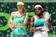 Maria Sharapova and Serena Williams pose for trophy ceremony at 2013 Sony Open