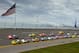 May 6, 2012; Talladega, AL, USA; A general view as NASCAR Sprint Cup Series cars race by an American Flag at the beginning of the Aarons 499 at Talladega Superspeedway. Mandatory Credit: Daniel Shirey-USA TODAY Sports