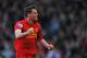 LIVERPOOL, ENGLAND - APRIL 21: Jamie Carragher of Liverpool celebrates the equalising goal scored by Luis Suarez during the Barclays Premier League match between Liverpool and Chelsea at Anfield on April 21, 2013 in Liverpool, England. (Photo by Michael Regan/Getty Images)