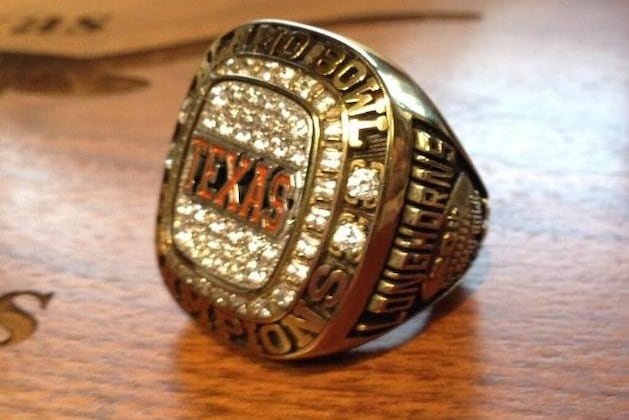 Mack Brown Hands out Rings to His Players for Winning Alamo Bowl