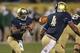 CHICAGO, IL - OCTOBER 06: Everett Golson #5 of the Notre Dame Fighting Irish pitches the ball to George Atkinson III #4 against the Miami Hurricanes at Soldier Field on October 6, 2012 in Chicago, Illinois. Notre Dame defeated Miami 41-3. (Photo by Jonathan Daniel/Getty Images)