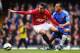 LONDON, ENGLAND - APRIL 01: Robin van Persie of Manchester United is closed down by Ryan Bertrand of Chelsea during the FA Cup with Budweiser Sixth Round Replay match between Chelsea and Manchester United at Stamford Bridge on April 1, 2013 in London, England. (Photo by Mike Hewitt/Getty Images)