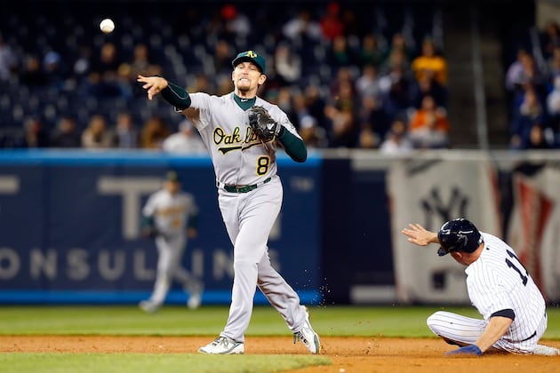 Hughes Gets 1st Win as Yanks Double Up A's
