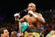 LAS VEGAS, NV - MAY 04: Floyd Mayweather Jr. celebrates his unanimous decision victory against Robert Guerrero in their WBC welterweight title bout at the MGM Grand Garden Arena on May 4, 2013 in Las Vegas, Nevada. (Photo by Al Bello/Getty Images)