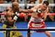 LAS VEGAS, NV - MAY 04: Floyd Mayweather Jr. (L) throws a left at Robert Guerrero during the fifth round of their WBC welterweight title bout at the MGM Grand Garden Arena on May 4, 2013 in Las Vegas, Nevada. Mayweather won by unanimous decision. (Photo by Ethan Miller/Getty Images)