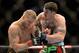 Mar 16, 2013; Montreal, Quebec, CAN; Chris Camozzi (blue) and Nick Ring (red) exchange blows during their main card bout at UFC 158 at the Bell Centre. Mandatory Credit: Eric Bolte-USA TODAY Sports