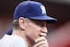 CINCINNATI, OH - JUNE 25: Manager Ron Roenicke #10 of the Milwaukee Brewers watches his team from the dugout during the game against the Cincinnati Reds at Great American Ball Park on June 25, 2012 in Cincinnati, Ohio. (Photo by John Grieshop/Getty Images)