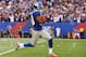 EAST RUTHERFORD, NJ - OCTOBER 21: Victor Cruz #80 of the New York Giants scores the winning touchdown against the Washington Redskins in the fourth quarter of a 27-23 Giant win at MetLife Stadium on October 21, 2012 in East Rutherford, New Jersey. (Photo by Al Bello/Getty Images)
