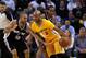 OAKLAND, CA - FEBRUARY 22: Jarrett Jack #2 of the Golden State Warriors drives on Tony Parker #9 of the San Antonio Spurs at Oracle Arena on February 22, 2013 in Oakland, California. The Warriors are wearing new short-sleeved uniforms for the first time. The Warriors won the game in overtime. NOTE TO USER: User expressly acknowledges and agrees that, by downloading and or using this photograph, User is consenting to the terms and conditions of the Getty Images License Agreement. (Photo by Ezra Shaw/Getty Images)