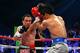 LAS VEGAS, NV - DECEMBER 08: (L-R) Juan Manuel Marquez throws a left at Manny Pacquiao during their welterweight bout at the MGM Grand Garden Arena on December 8, 2012 in Las Vegas, Nevada. (Photo by Al Bello/Getty Images)