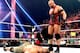 Ryback stands over John Cena in the ring. (Photo credit: WWE.com)