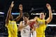 ARLINGTON, TX - MARCH 29: Jeff Withey #5 of the Kansas Jayhawks is defended by Glenn Robinson III #1 and Mitch McGary #4 of the Michigan Wolverines in the second half during the South Regional Semifinal round of the 2013 NCAA Men's Basketball Tournament at Dallas Cowboys Stadium on March 29, 2013 in Arlington, Texas. (Photo by Tom Pennington/Getty Images)