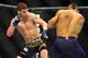 Jan, 20 2012; Nashville, TN, USA; UFC bantamweight Mike Easton boxes with Jared Papazian during a bout in the UFC on FX 1 event. Easton defeated Papazian. Mandatory Credit: Don McPeak-USA TODAY Sports
