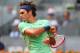 MADRID, SPAIN - MAY 07: Roger Federer of Switzerland in action against Radek Stepanek of Czech Republic during day four of the Mutua Madrid Open tennis tournament at the Caja Magica on May 7, 2013 in Madrid, Spain. (Photo by Julian Finney/Getty Images)