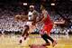 MIAMI, FL - MAY 06: LeBron James #6 of the Miami Heat drives against Jimmy Butler #21 of the Chicago Bulls during Game One of the Eastern Conference Semifinals of the 2013 NBA Playoffs at American Airlines Arena on May 6, 2013 in Miami, Florida. NOTE TO USER: User expressly acknowledges and agrees that, by downloading and/or using this photograph, user is consenting to the terms and conditions of the Getty Images License Agreement. (Photo by Chris Trotman/Getty Images)