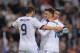 MADRID, SPAIN - MAY 08: Mesut Ozil (C) of Real Madrid CF celebrates with Cristiano Ronaldo (R) and Karim Benzema after scoring Real's third goal during the La Liga match between Real Madrid CF and Malaga CF at estadio Santiago Bernabeu on May 8, 2013 in Madrid, Spain. (Photo by Denis Doyle/Getty Images)
