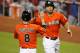 MIAMI, FL - APRIL 28: Giancarlo Stanton #27 of the Miami Marlins celebrates a two run home run against the Chicago Cubs with teammate Chris Coghlan #8 at Marlins Park on April 28, 2013 in Miami, Florida. (Photo by Marc Serota/Getty Images)