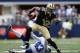 ARLINGTON, TX - DECEMBER 23: Marques Colston #12 of the New Orleans Saints runs the ball past Gerald Sensabaugh #43 of the Dallas Cowboys at Cowboys Stadium on December 23, 2012 in Arlington, Texas. (Photo by Ronald Martinez/Getty Images)