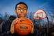 Apr. 5, 2013; Chicago, IL, USA; Simeon Career Academy varsity basketball team member Jabari Parker poses on an outdoor court near the school on the south side of Chicago. Parker, a 6 foot 8 inch senior, has verbally committed to attending Duke University in the fall. Mandatory Credit: Guy Rhodes-USA TODAY Sports