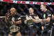 Jan 26, 2013; Chicago, IL, USA; Demetrious Johnson (left) celebrates after defeating John Dodson (not pictured) during UFC on FOX 6 for the world flyweight championship at the United Center. Mandatory Credit: David Banks-USA TODAY Sports