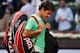MADRID, SPAIN - MAY 09: Roger Federer of Switzerland trudges off the pitch after his match against Kei Nishikori of Japan on day six of the Mutua Madrid Open tennis tournament at the Caja Magica on May 9, 2013 in Madrid, Spain. (Photo by Gonzalo Arroyo Moreno/Getty Images)