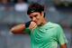 MADRID, SPAIN - MAY 09: Roger Federer of Switzerland reacts in his match against Kei Nishikori of Japan on day six of the Mutua Madrid Open tennis tournament at the Caja Magica on May 9, 2013 in Madrid, Spain. (Photo by Gonzalo Arroyo Moreno/Getty Images)