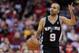 Mar 24, 2013; Houston, TX, USA; San Antonio Spurs point guard Tony Parker (9) dribbles against the Houston Rockets during the second half at the Toyota Center. The Rockets won 96-95. Mandatory Credit: Thomas Campbell-USA TODAY Sports